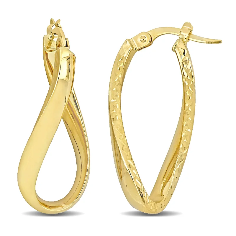 Elegant Jewelry, Affordable Luxury – Shop Now 28 MM Oval Twist Texture and Polished Hoop Earrings in 14K Yellow Gold